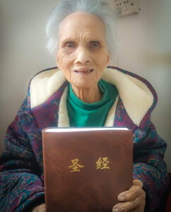 Tang with her large-print Bible
