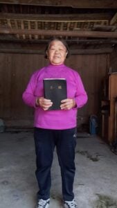 Fang holding her large-print Bible