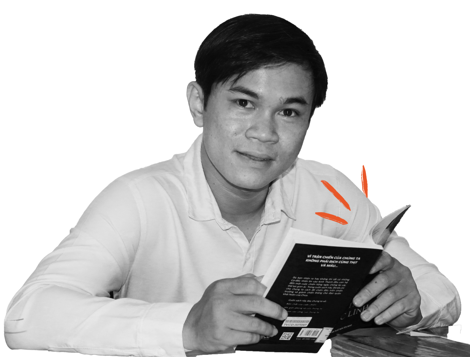 Happy young man reading a book at the Christian Library in Ho Chi Minh City