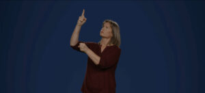 Trudy signing 'God' in Auslan