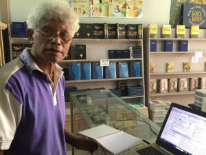 Futuna Bible translator Elder Yama with his new laptop from BSA